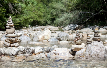 balancing stones on the mountain river