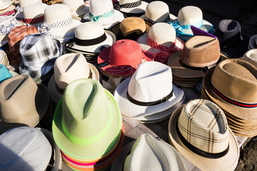 Many hats from the sun. Women's Men's  designer hats from the sun of different colors. Beach hats...