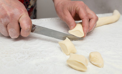 Cook cooks dough for pieces