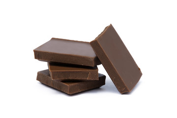 Milk chocolate pieces isolated on white background