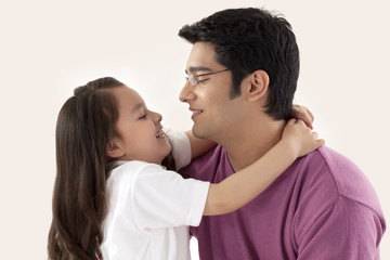 Father and little daughter hugging 