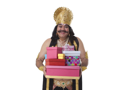 Man dressed as Raavan holding gifts 