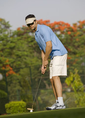 Golfer about to strike 