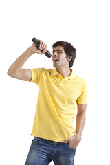 Young man with a microphone singing