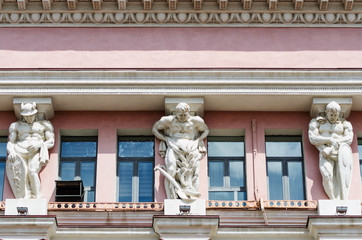 Atlanties supporting the cornice of the building / Photo taken in Russia, in the city of Orenburg © vadim_orlov