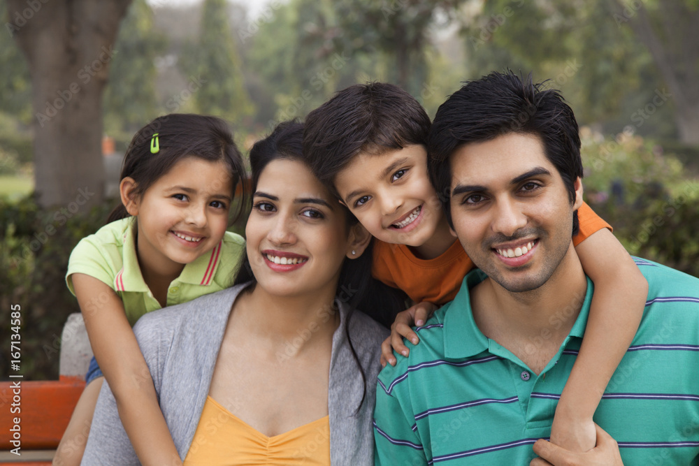 Wall mural Portrait of a happy family outdoors