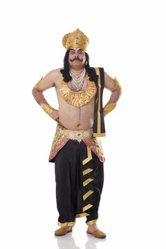 Man dressed as Raavan looking serious 