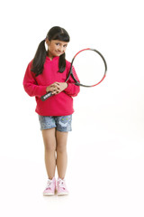 Obraz na płótnie Canvas Girl holding tennis racquet