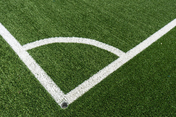 Obraz premium corner lines of football field on plastic green