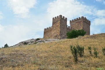 Fototapeta na wymiar The ancient castle on the mountain.