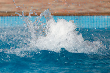 Splashing water in the pool as a background
