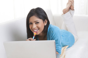 Portrait of girl with laptop smiling