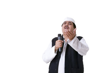 Male politician with microphone speaking 