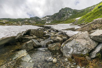 Snowmelt at a creek in Caucasus