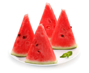 Slices of watermelon on plate isolated on white background.
