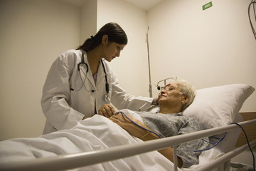 Doctor checking on her patient 