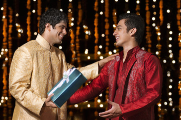 Two men exchanging gifts