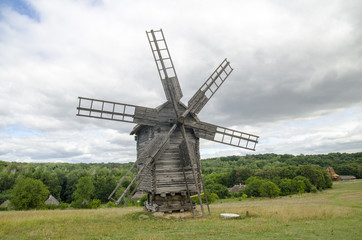 Fototapeta na wymiar Old windmill and beautiful landscape