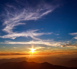 Majestic sunset sky over mountain ridge
