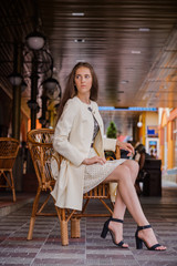 Young woman wearing in a autumn coat