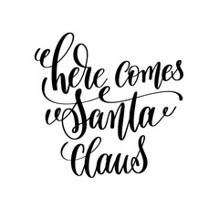 here comes santa claus hand lettering inscription to winter holi