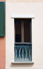 Fototapeta na wymiar Window and shutters in Bologna, Italy, spring, 2017.