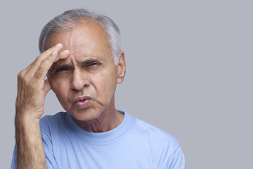 Fototapeta premium Close-up of senior man suffering from headache 