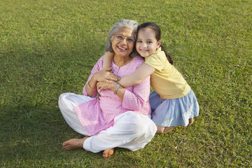 Fototapeta premium Portrait of grandmother and granddaughter smiling