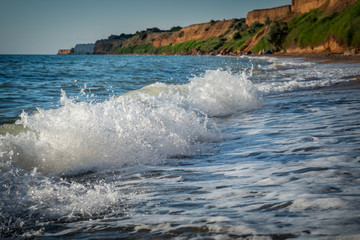 Foamy wave rushes to shore