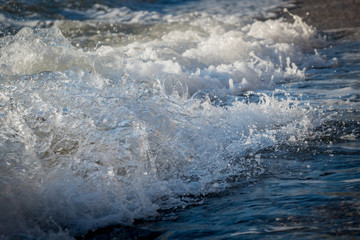 Foamy wave rushes to shore