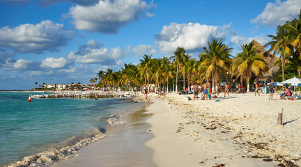 Fototapeta na wymiar Isla Mujeres Beach Mexico / Peaceful North Beach with palm trees