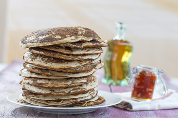 Glutten-free pancakes with jam and Maple syrup, ingredients, background