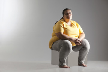 Portrait of an obese woman sitting