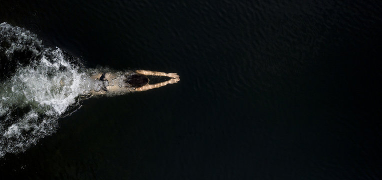 Young Female Swimming Underwater