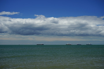 the sea in the Kerch Strait with the Azov sea waves on the background of blue sky