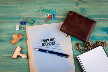 Import Export concept. Notebook on a bright green background. Office stationery accessories.