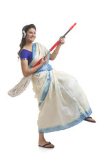 Housewife having fun while listening to music