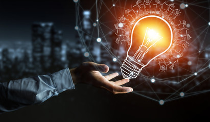 Businessman holding a sketch lightbulb