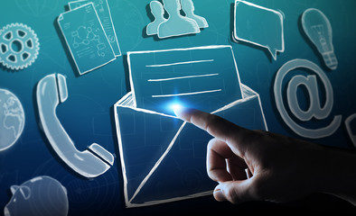 Businessman touching manuscript email icon with his finger