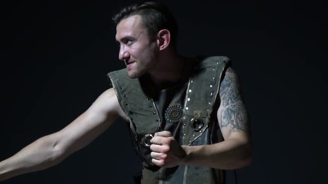 Side view on dark haired legionnaire dances, slow motion shooting