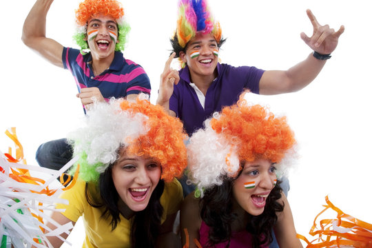 Youngsters with wigs cheering 