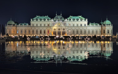Fototapeta na wymiar Upper Belvedere Palace with Christmas Village in Vienna in night, Austria