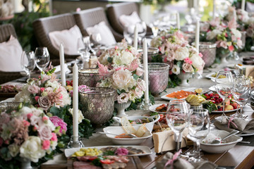 linen textile. Decorated table, a plate of neatly arranged napkin, fork and knife.