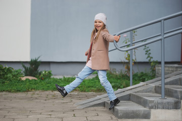 beautiful young girl posing on the street