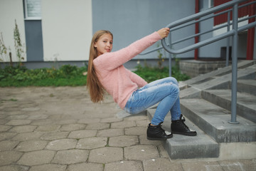 beautiful young girl posing on the street