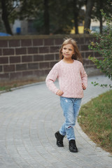 beautiful young girl posing on the street