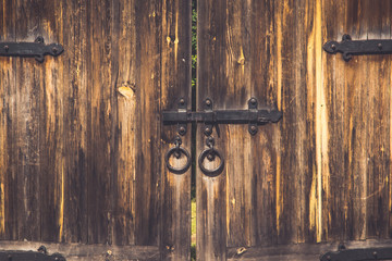 Old wooden gate with a bolt