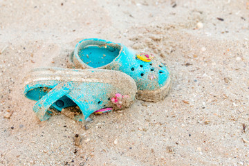 A pair of small turquoise kid's slippers