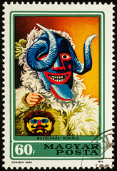 Fototapeta premium Hungarian carnival mask on postage stamp