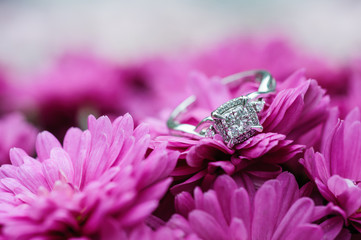 engagement ring on flower, selective focus